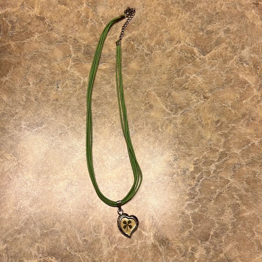 Lightweight necklace a shamrock charm. Never worn.